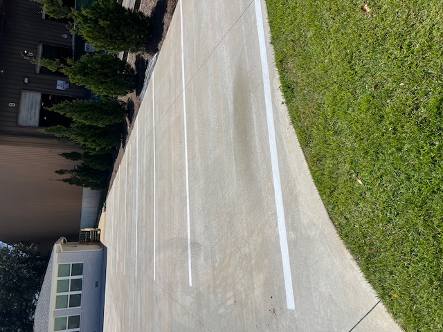 Enhancing Safety and Visibility: Parking Lot Striping and Bollard Installation on Davis Hwy in Pensacola, FL