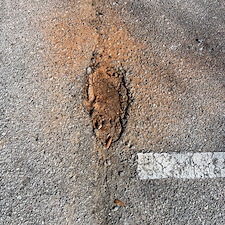 Expert-Pothole-Repair-Enhances-Safety-and-Aesthetics-for-Pensacola-Commercial-Parking-Lot 0