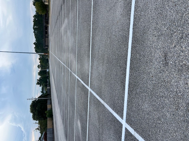 Precision Parking Lot Striping at Navarre High School by Parking Lot Maintenance of the Panhandle